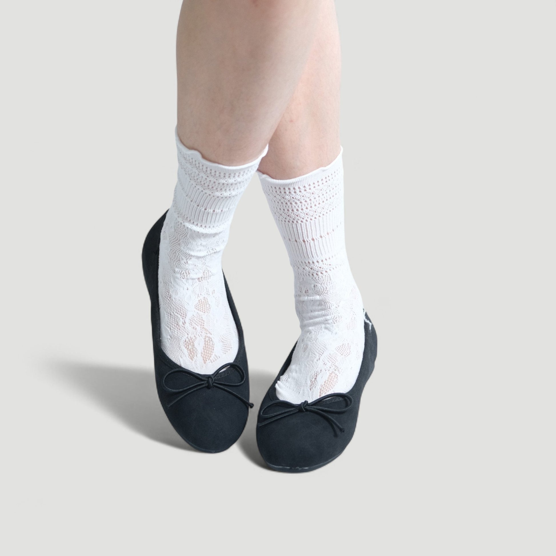 black almond toe bow ballet flats model posing