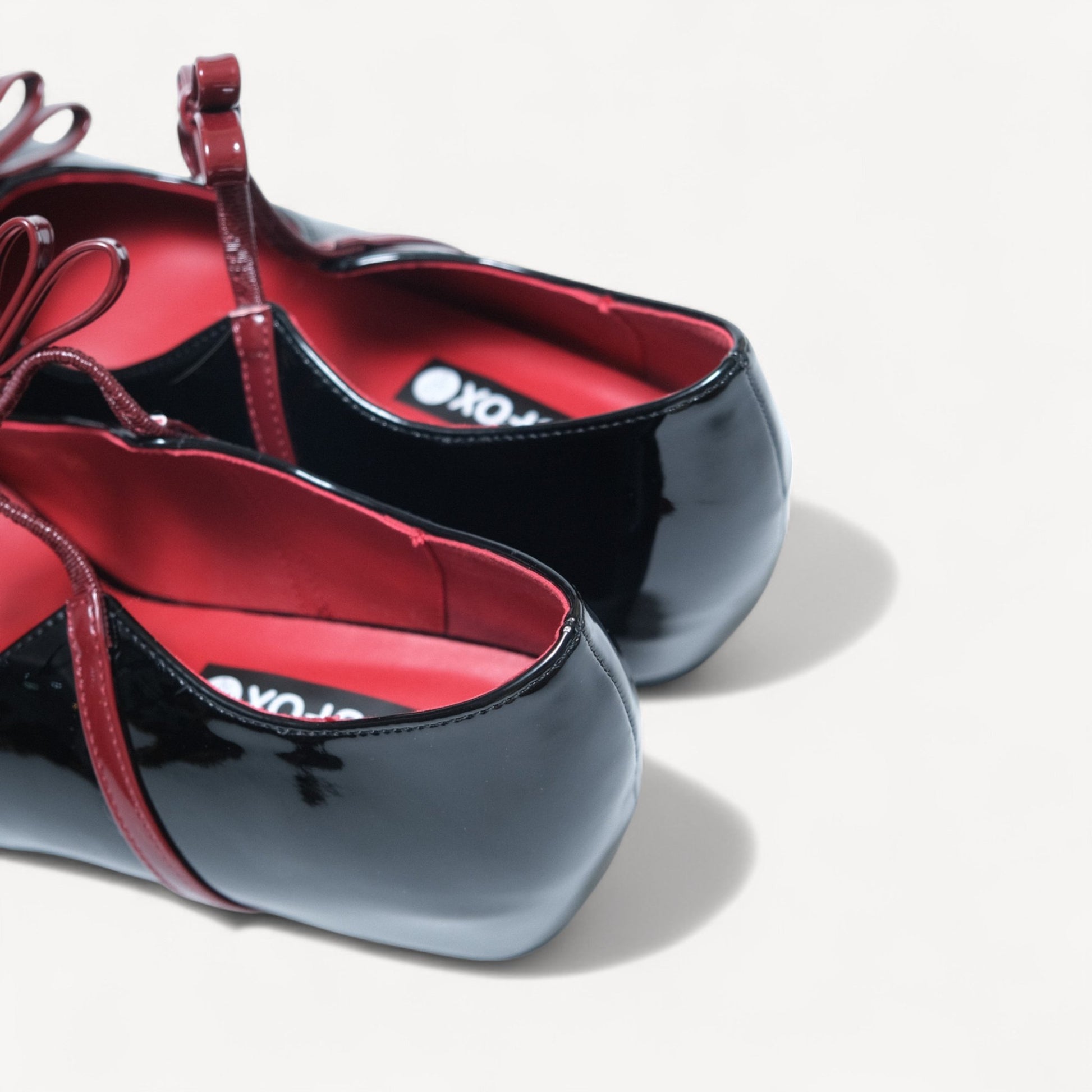 black patent mary jane bow flats heel detail