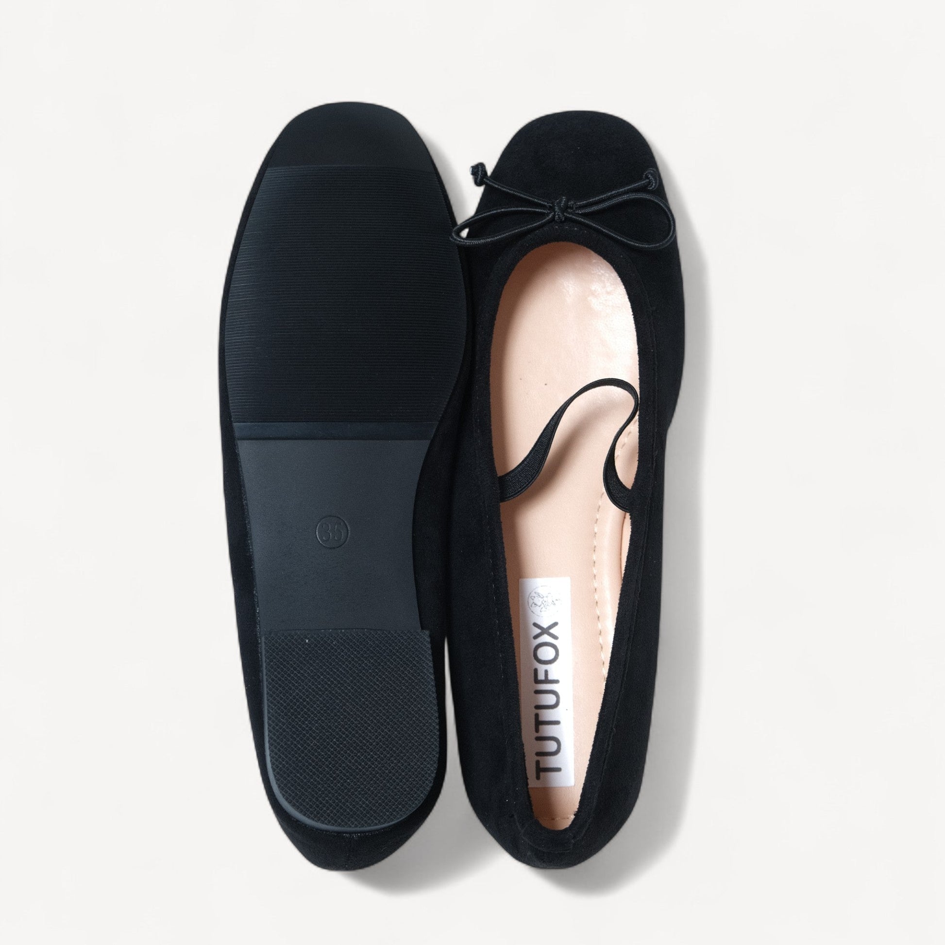 black suede almond toe flats sole view