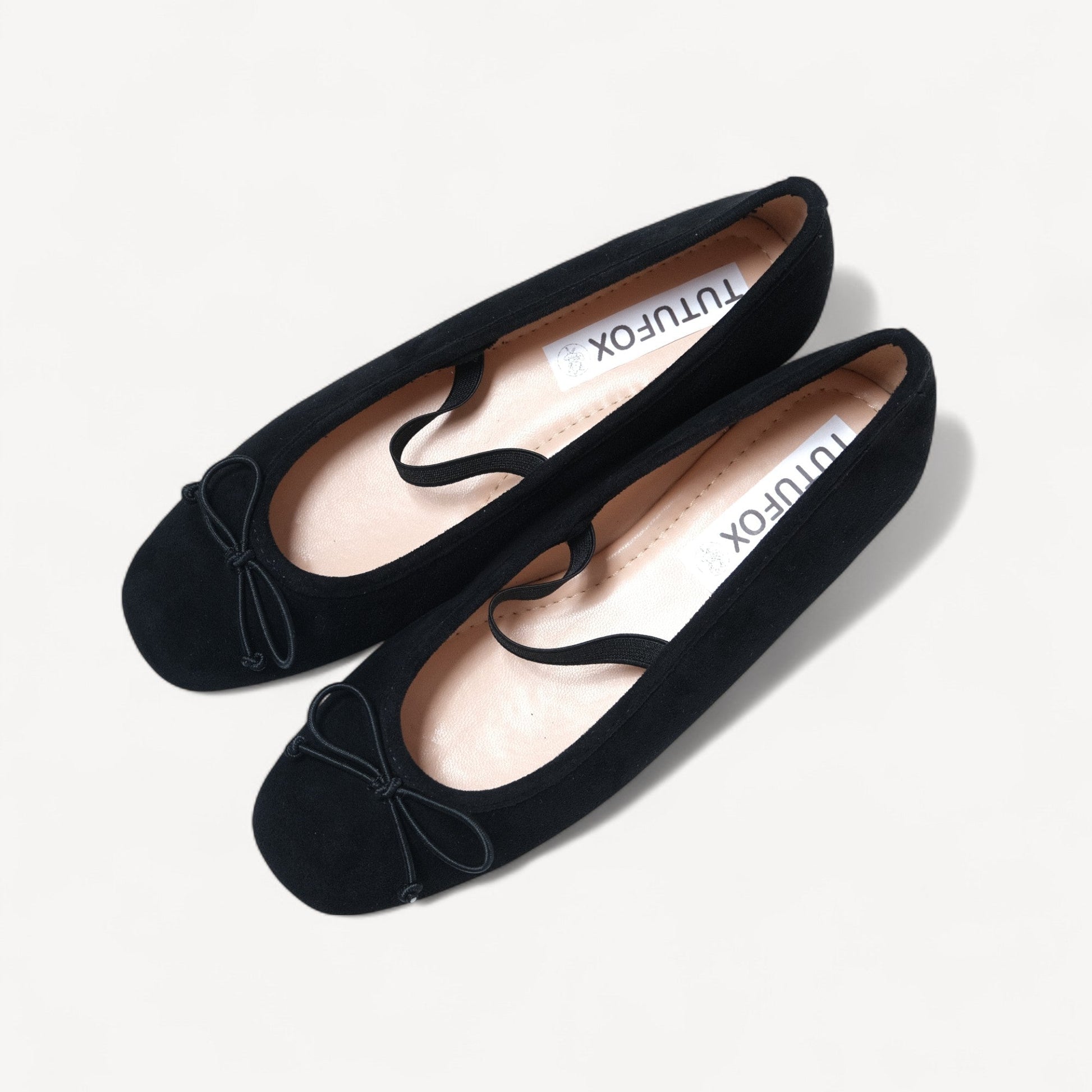 black suede almond toe flats oblique view