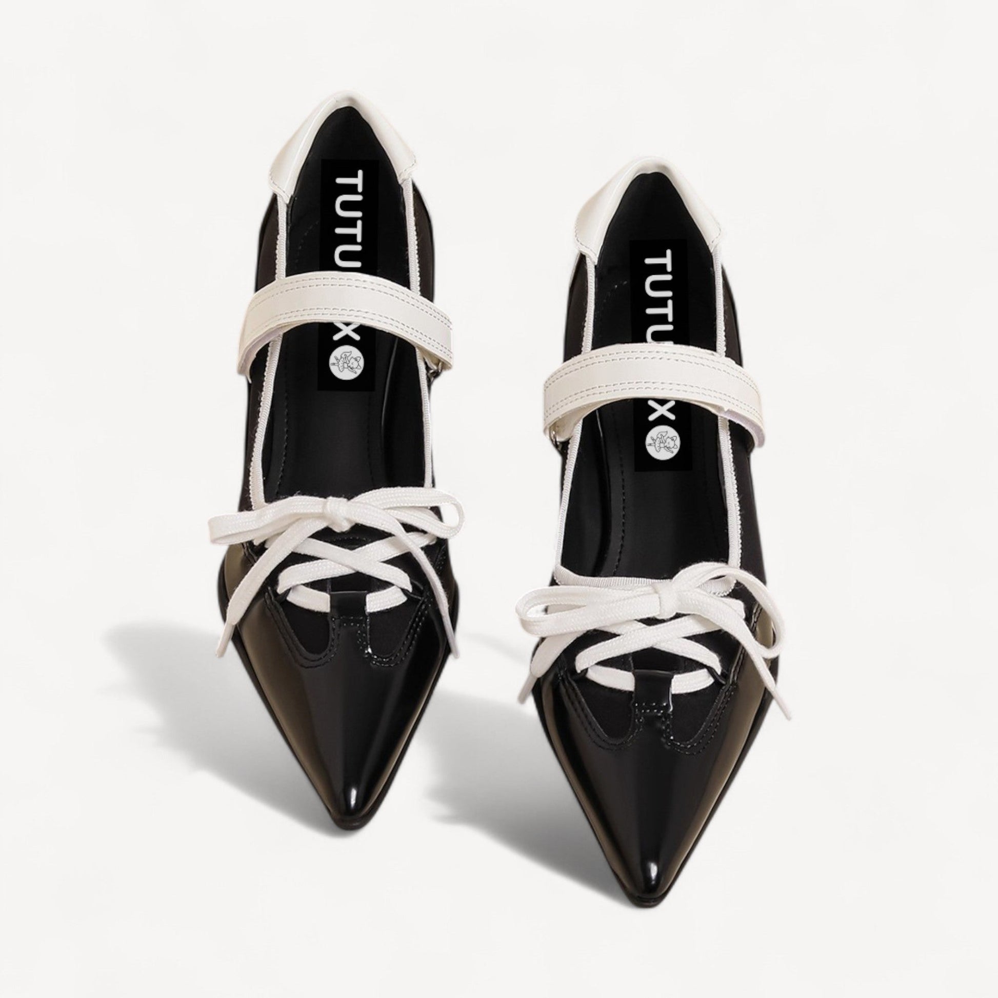 black white pointed toe lace up flats front view