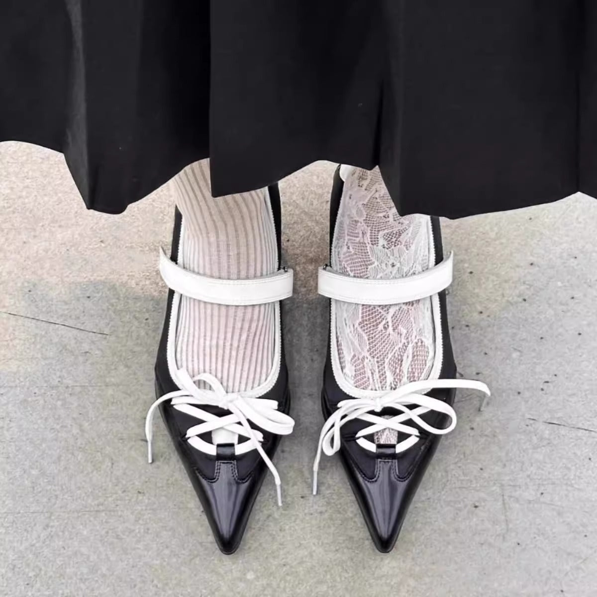 black white pointed toe lace up flats model posing