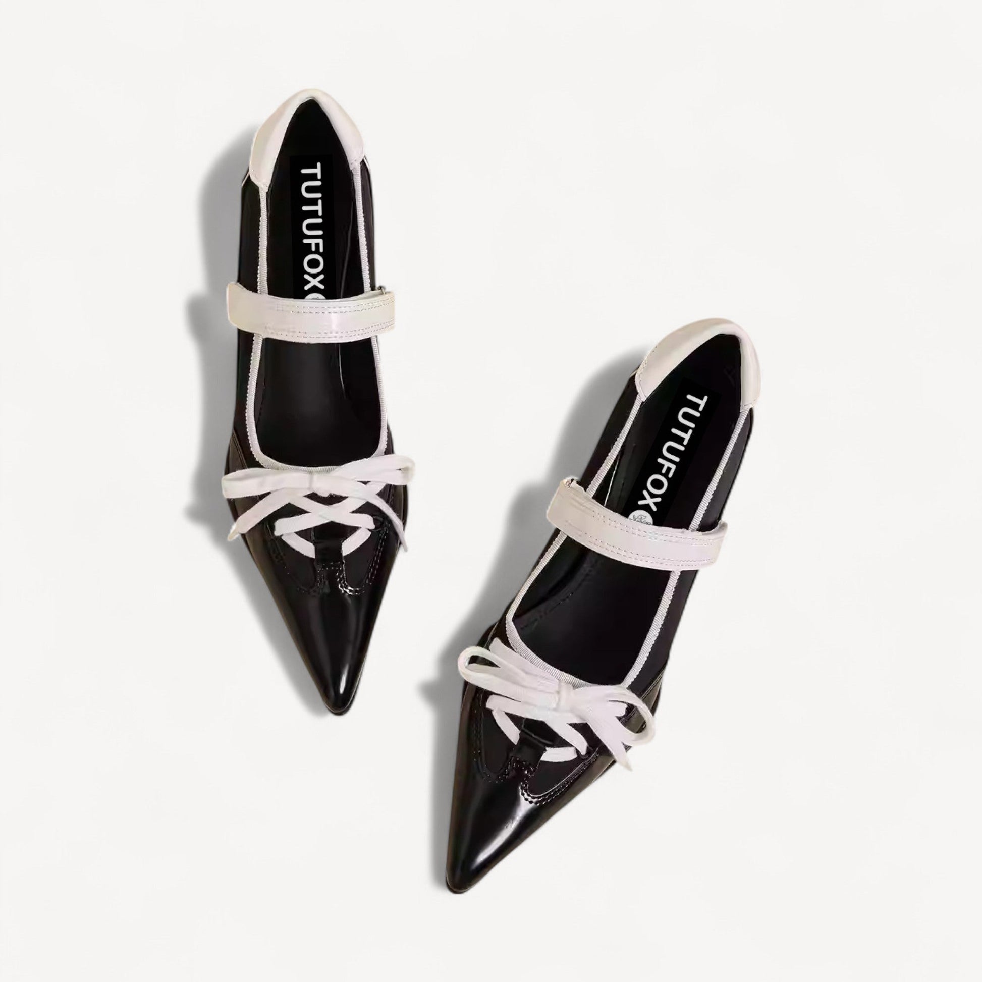 black white pointed toe lace up flats front view