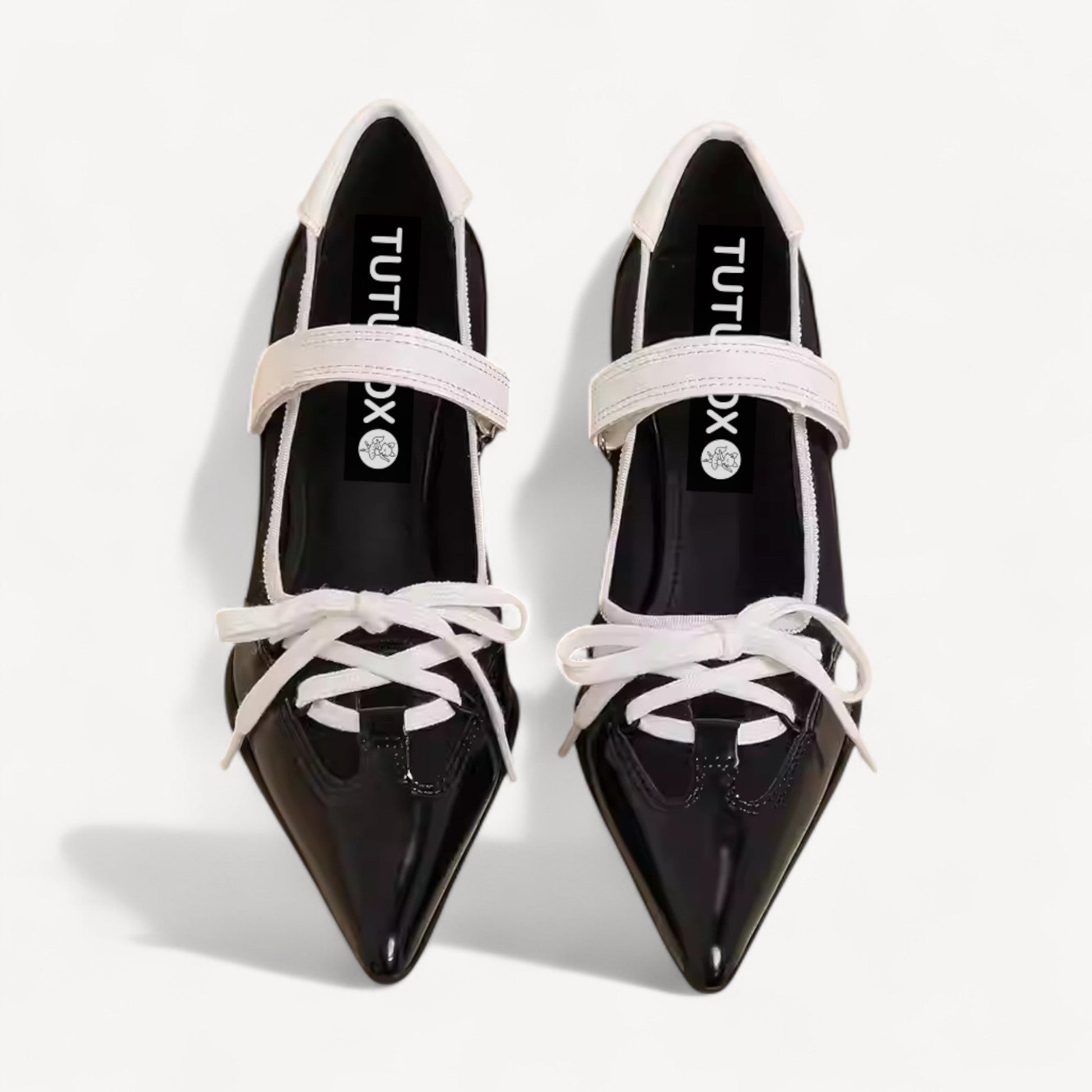 black white pointed toe lace up flats front view