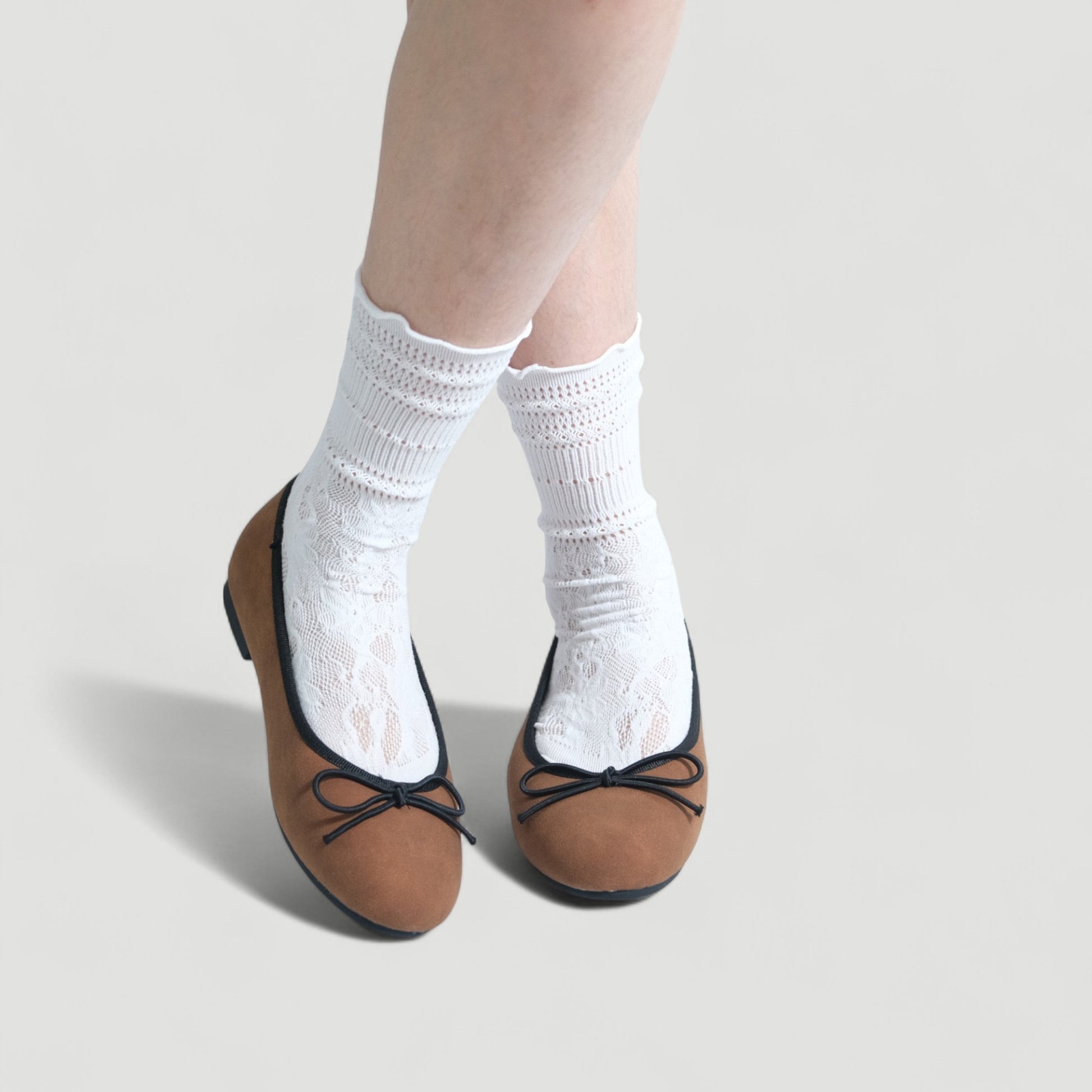 brown almond toe ballet bow flats model posing