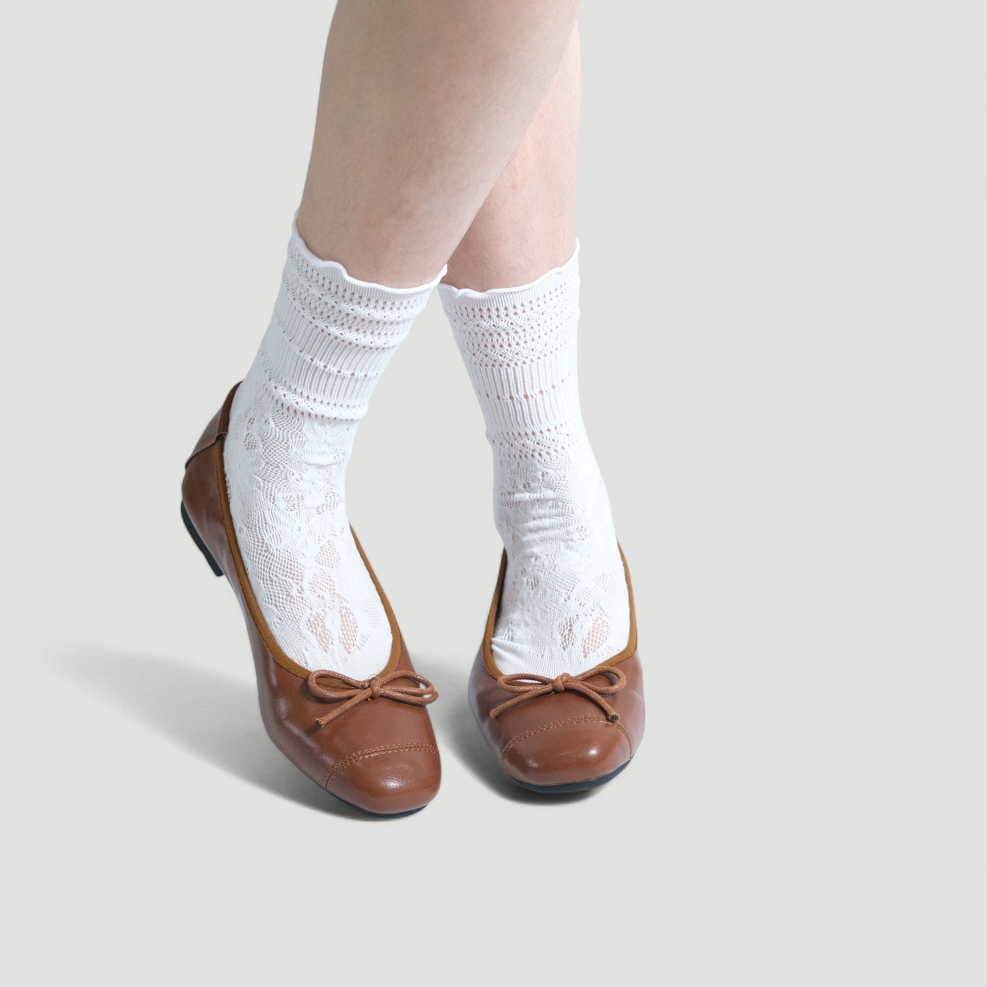 brown soft leather bow ballet flats model posing