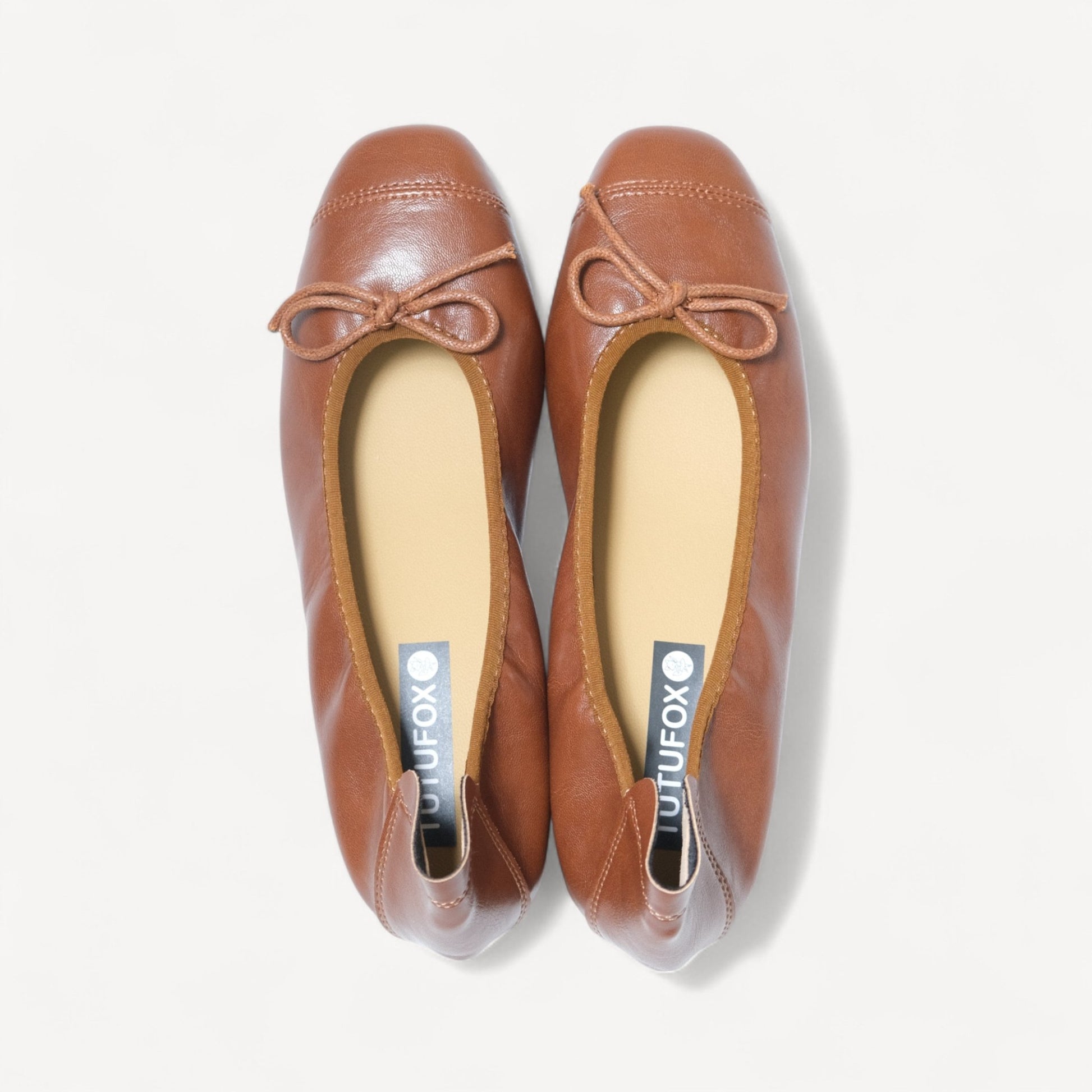 brown soft leather bow ballet flats front view