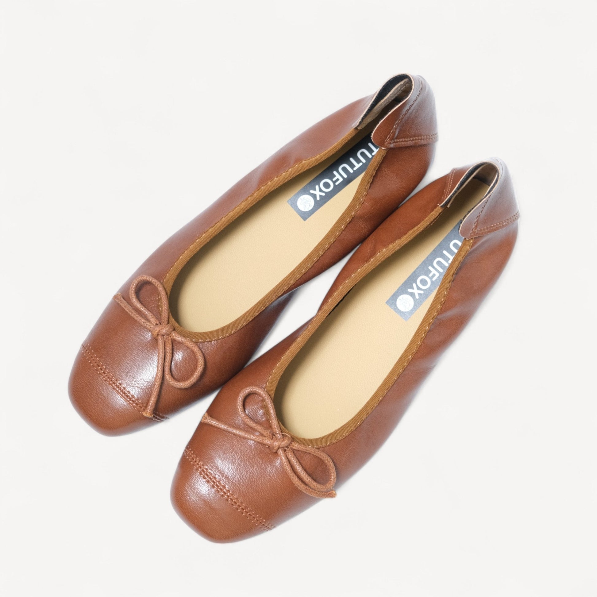brown soft leather bow ballet flats oblique view