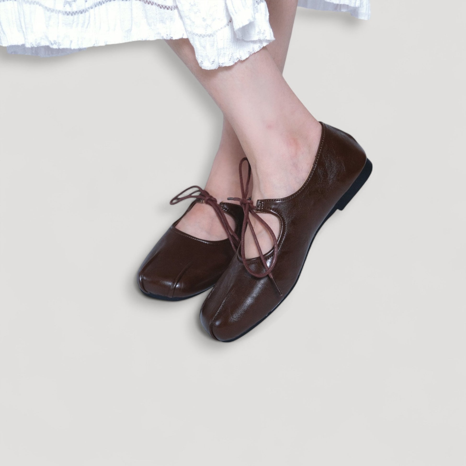brown square toe leather lace up flats model posing
