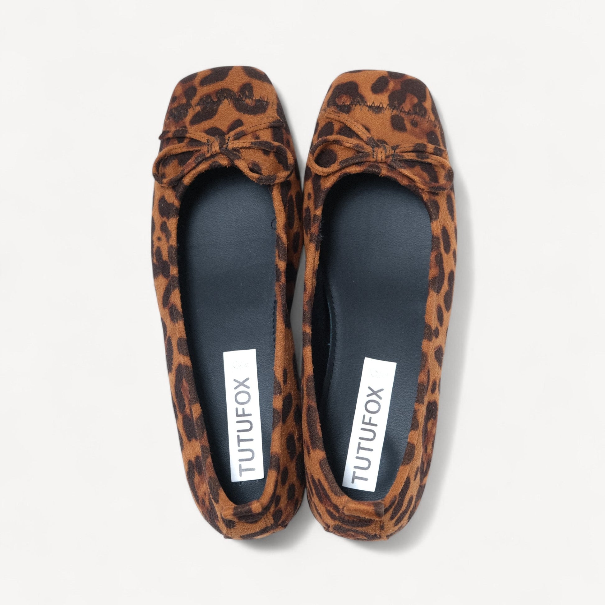 leopard suede bow low heel ballet flats front view