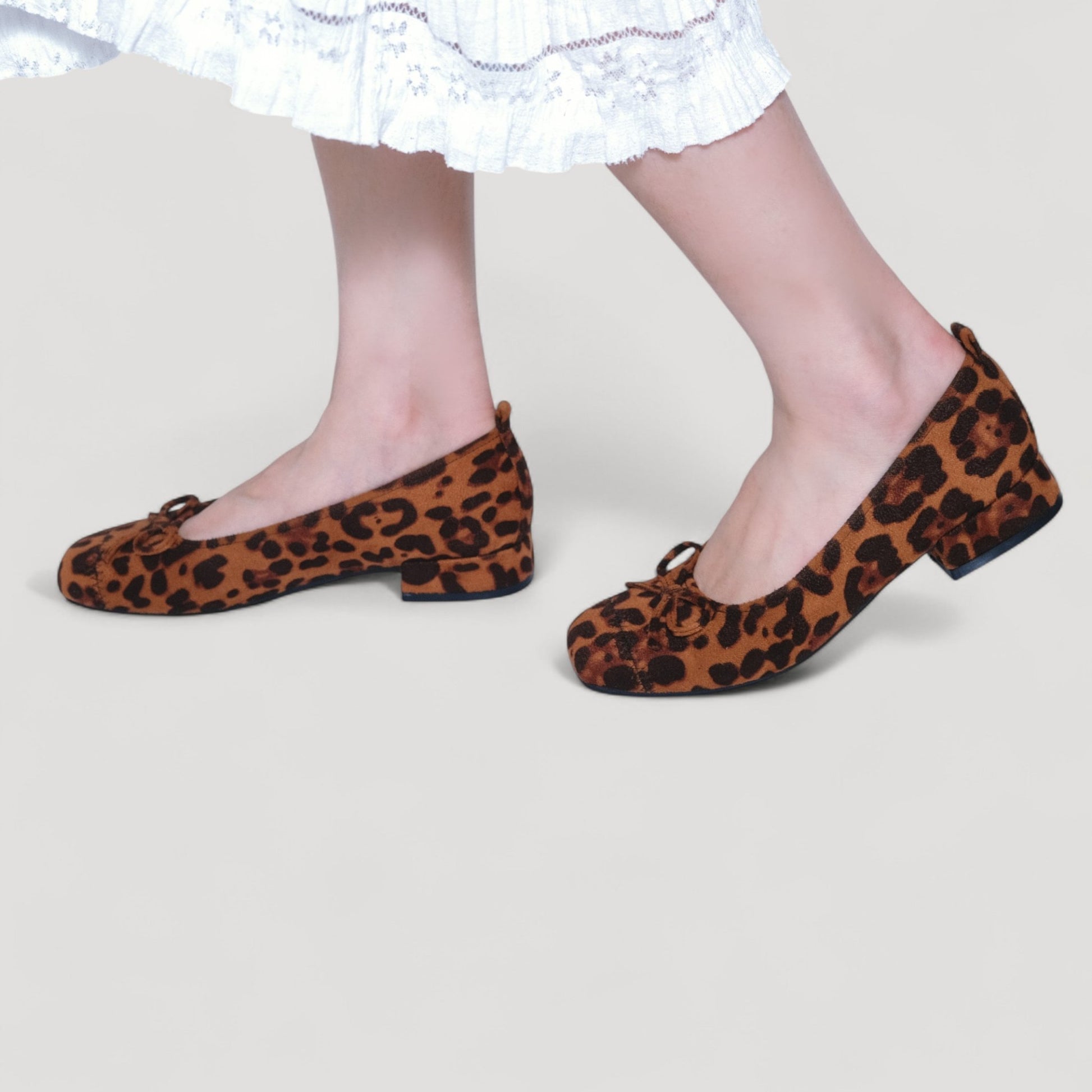 leopard suede bow low heel ballet flats model walking view