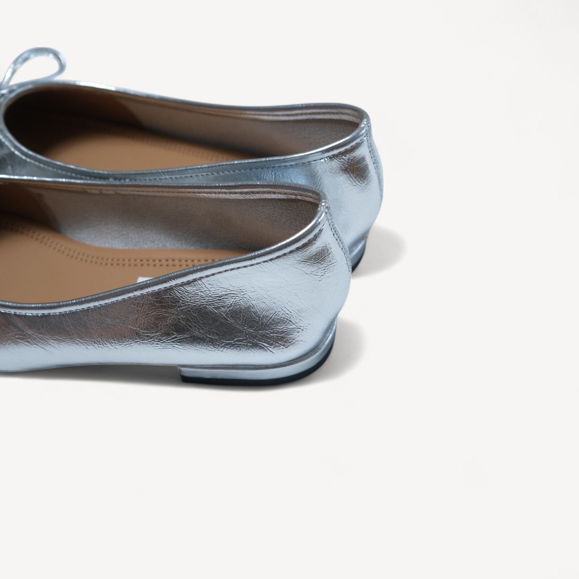 silver bow square toe ballet flats heel details view