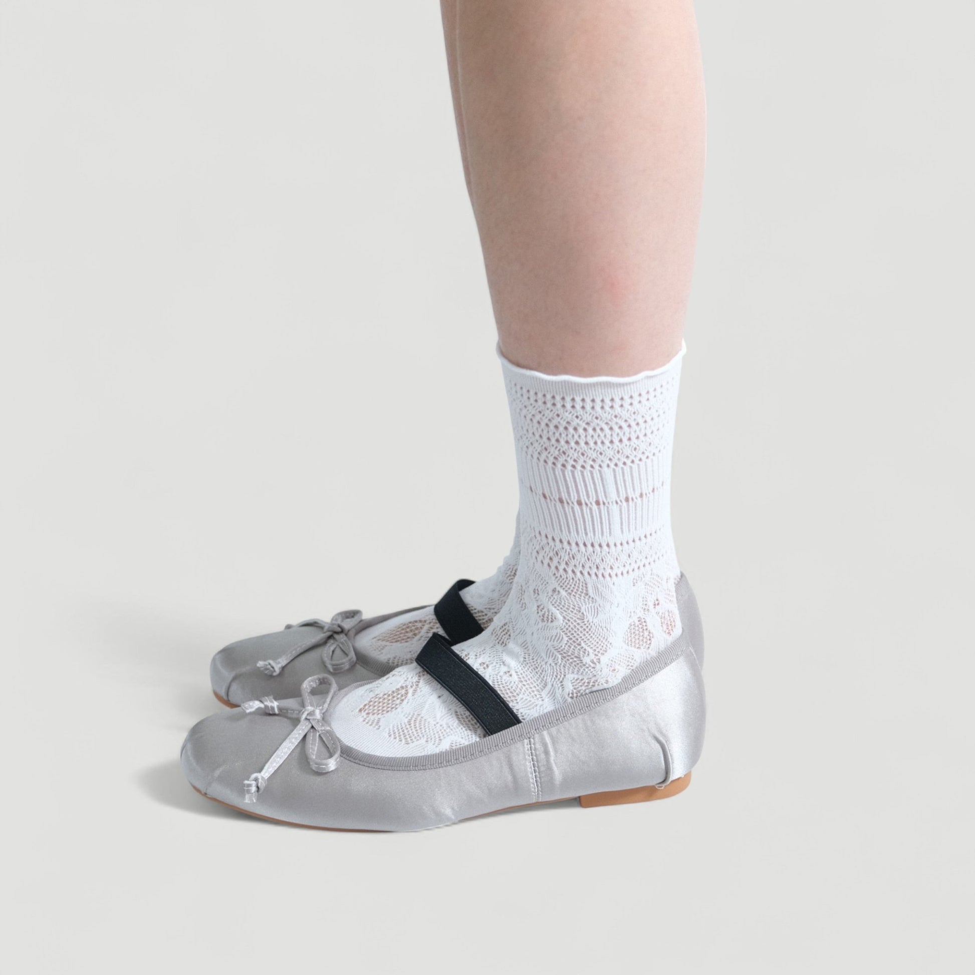 silver satin ballet flats model standing