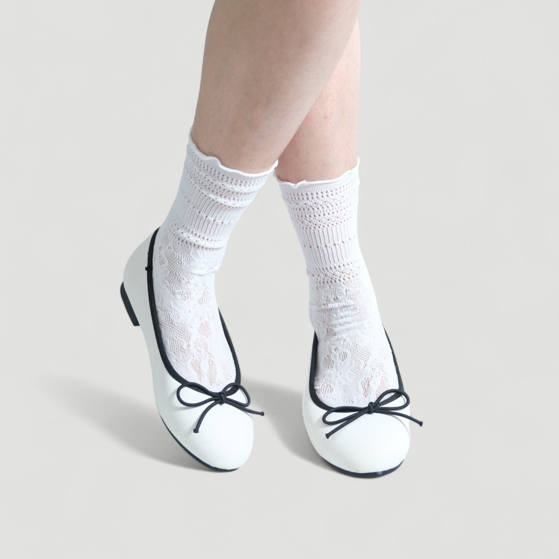 white almond toe bow ballet flats model posing