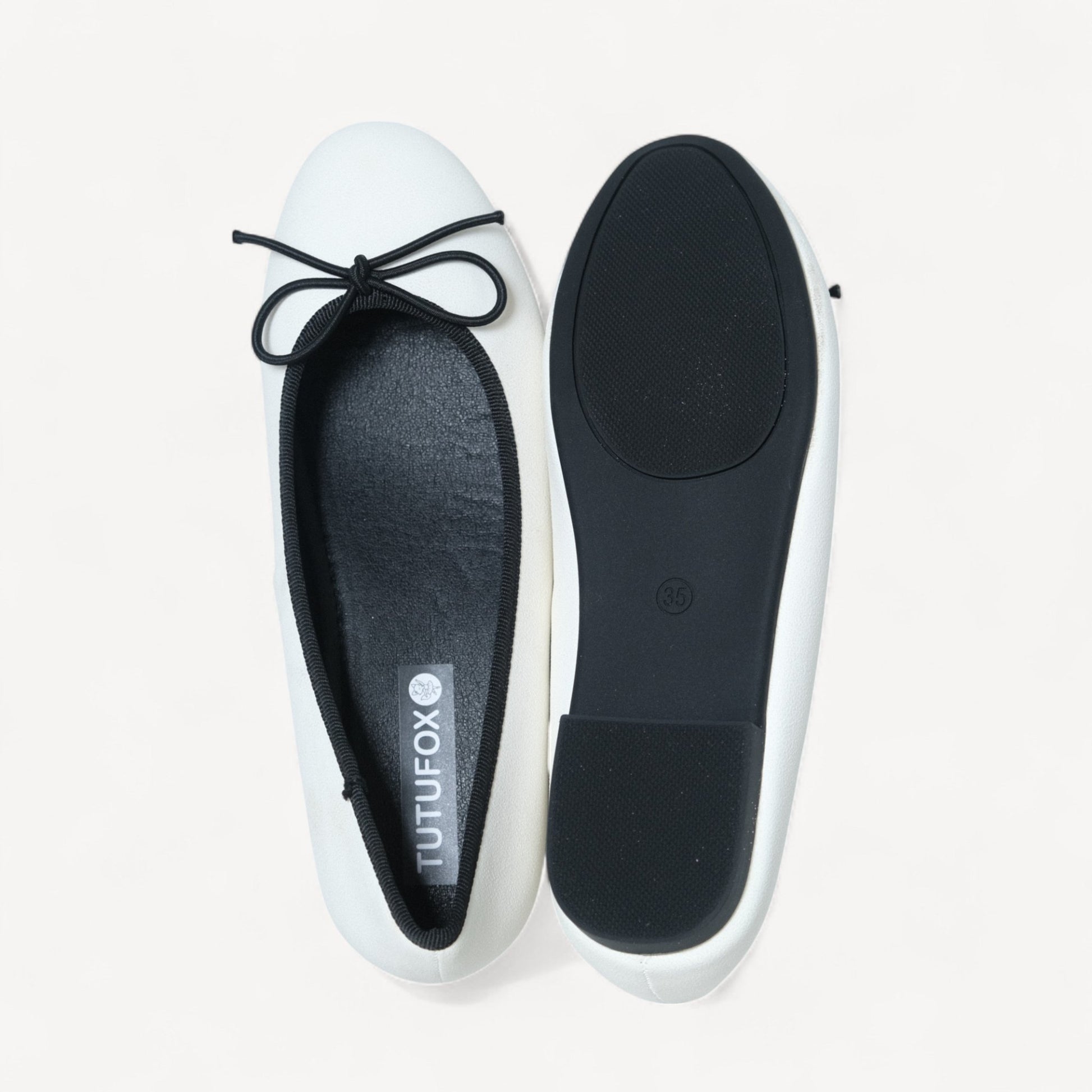 white almond toe bow ballet flats sole view