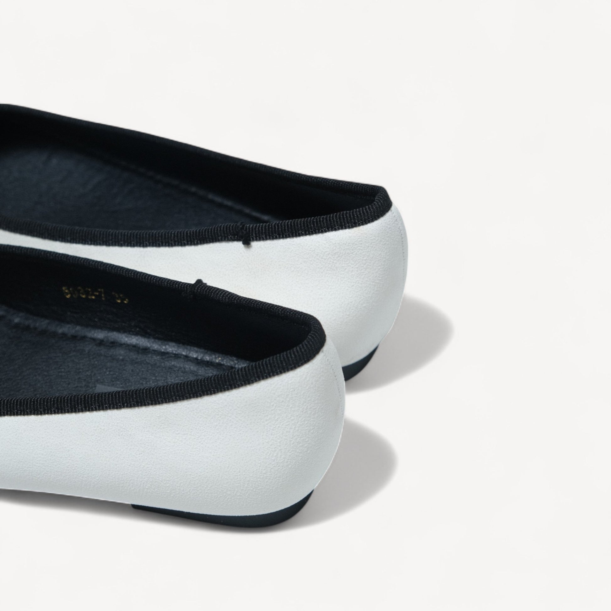 white almond toe bow ballet flats heel detail