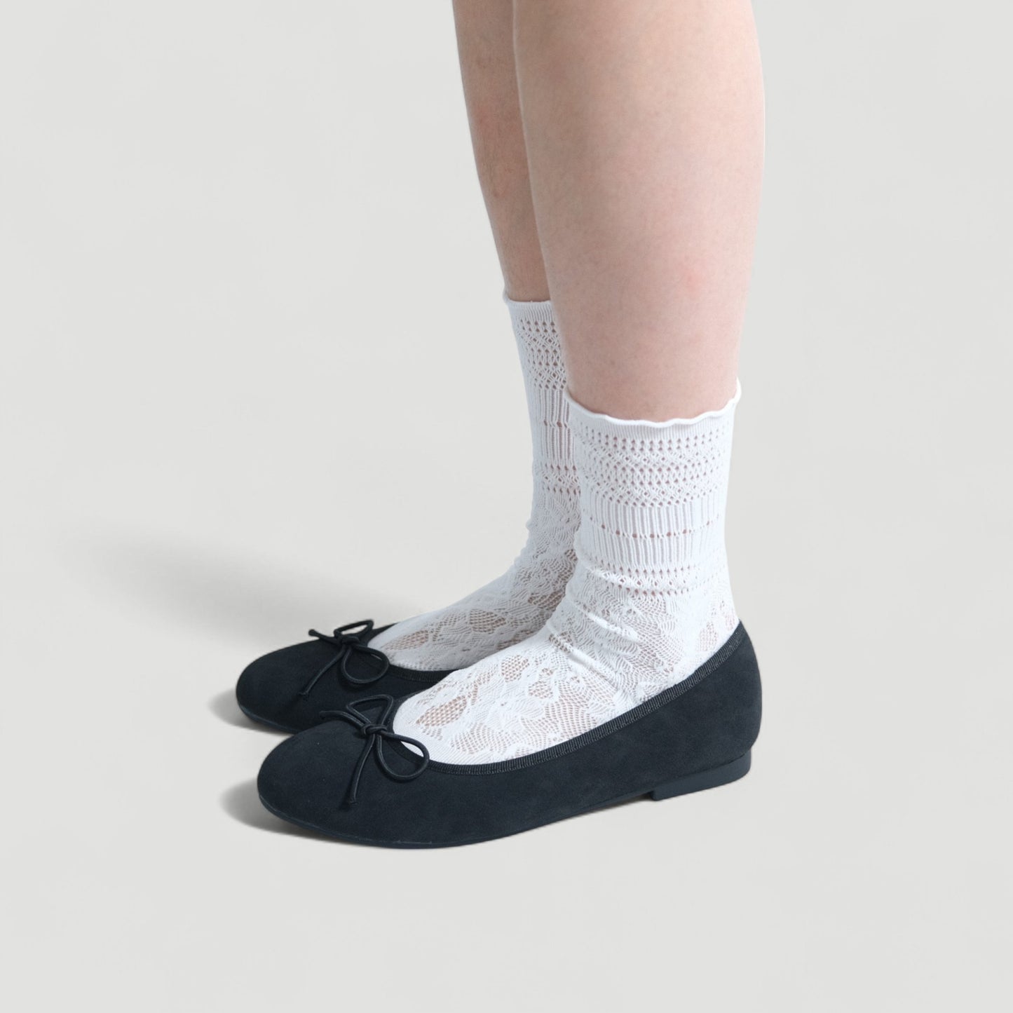 black almond toe bow ballet flats model standing  