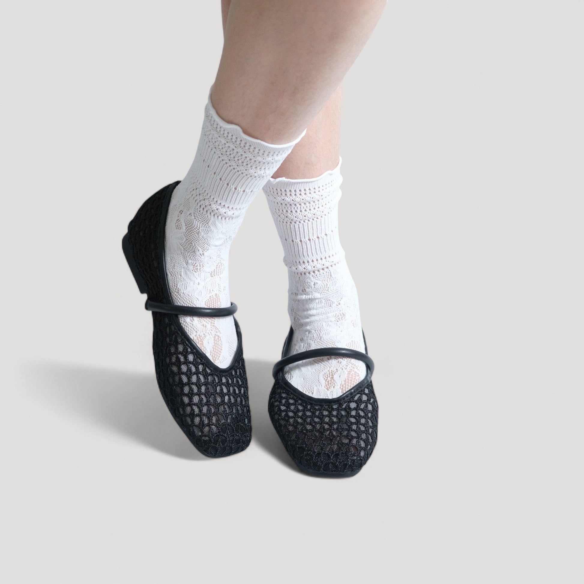 black mary jane almond toe flats sandals model posing  