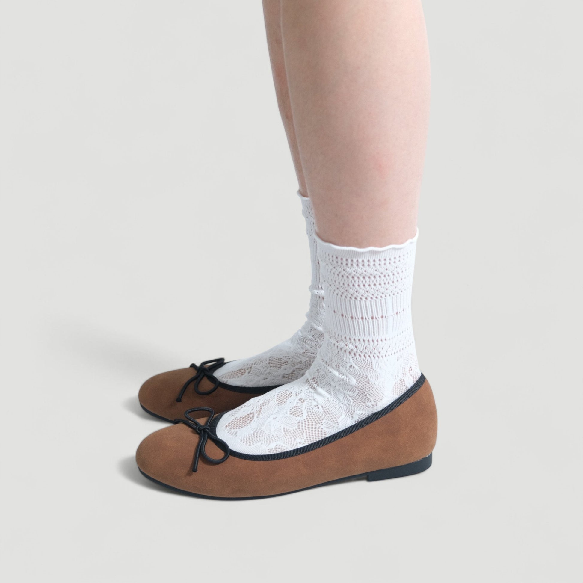 brown almond toe ballet bow flats model standing  