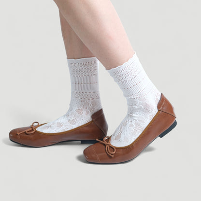 brown soft leather bow ballet flats model walking  