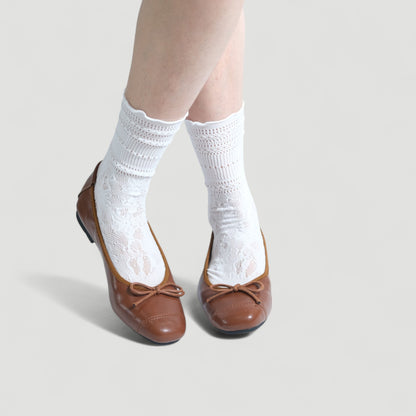 brown soft leather bow ballet flats model posing  