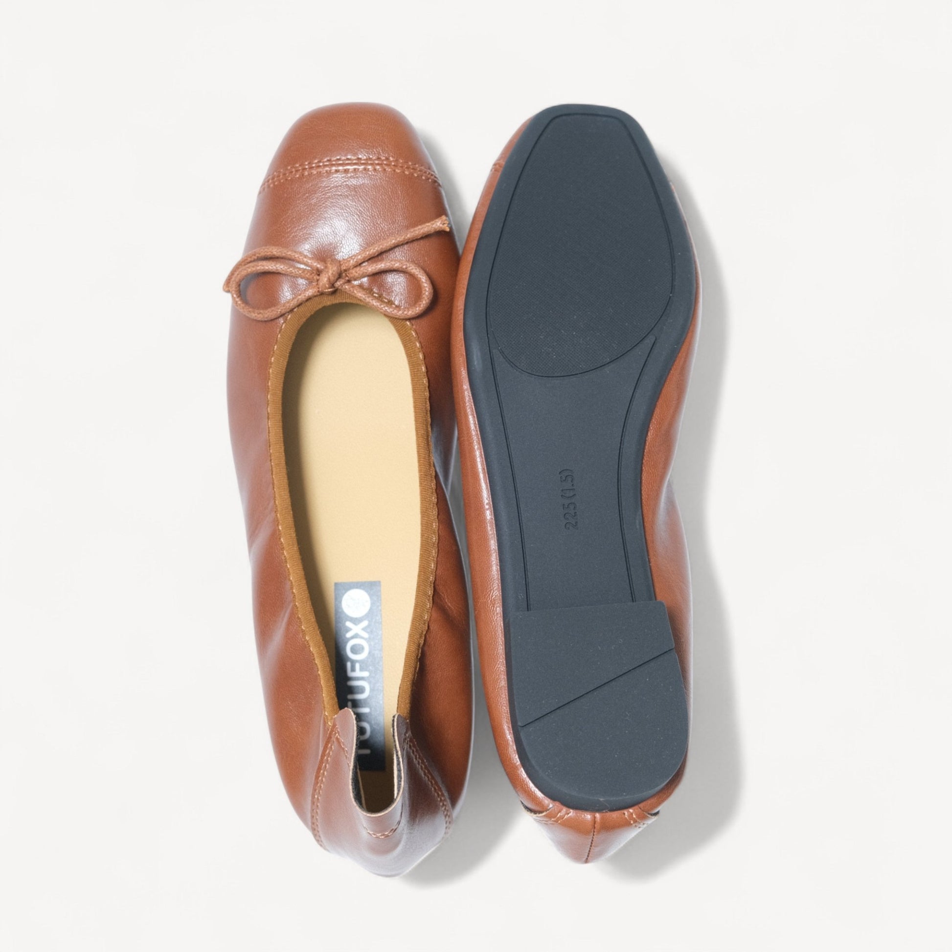 brown soft leather bow ballet flats sole view 