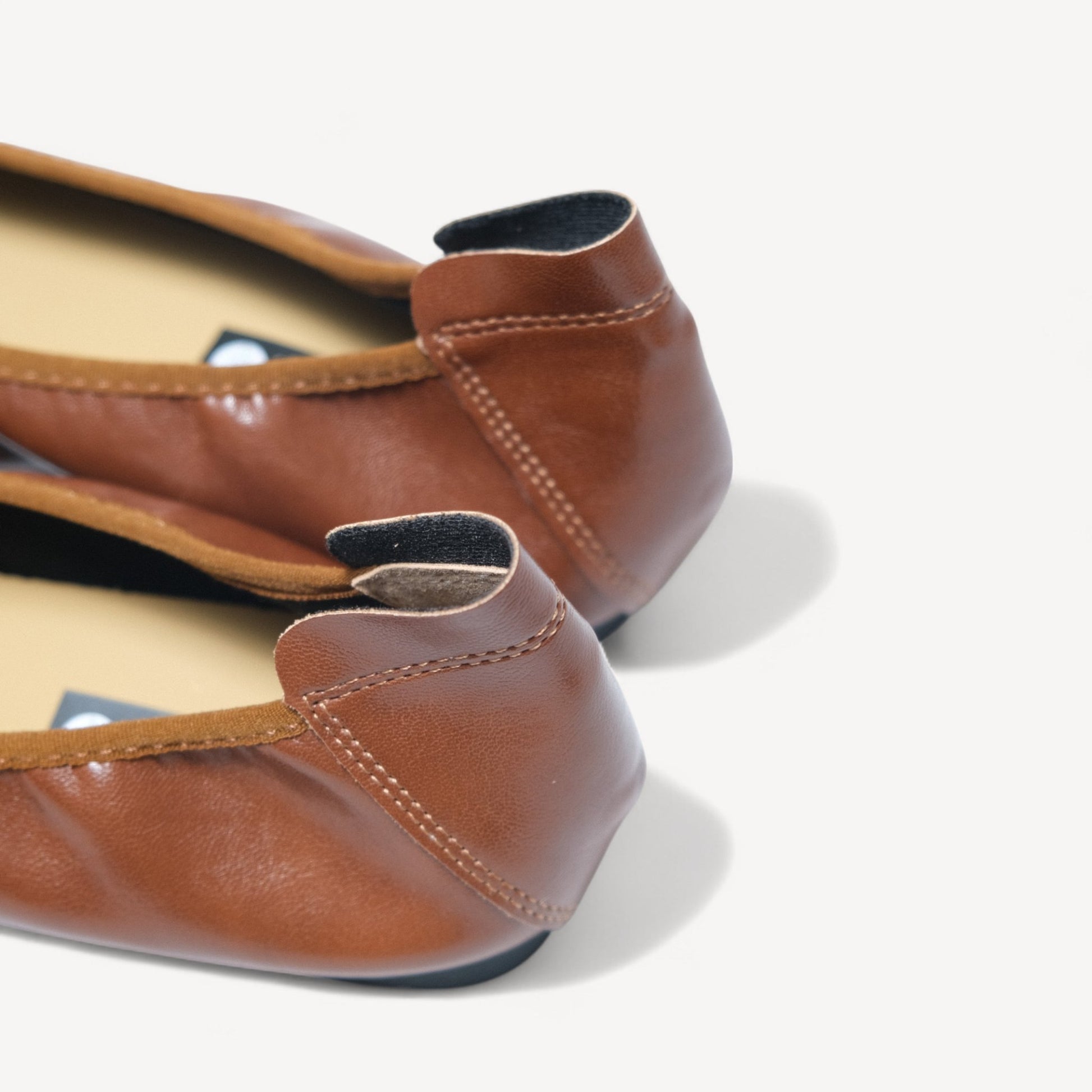 brown soft leather bow ballet flats heel detail 