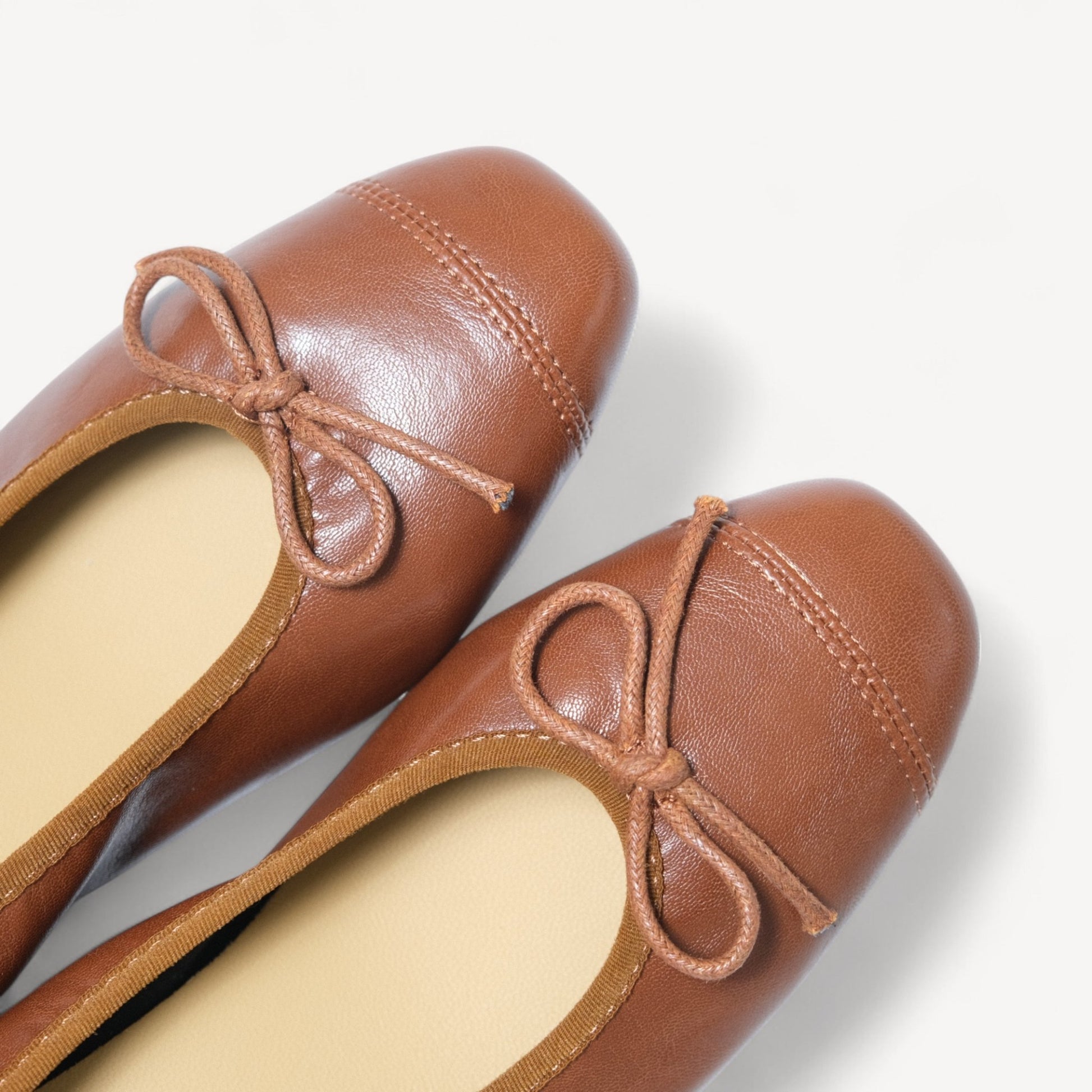 brown soft leather bow ballet flats toe detail  