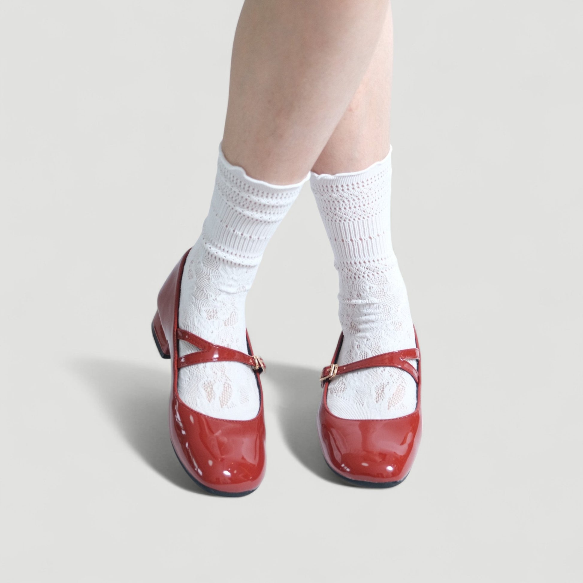 red patent mary jane buckle round toe flats model posing  