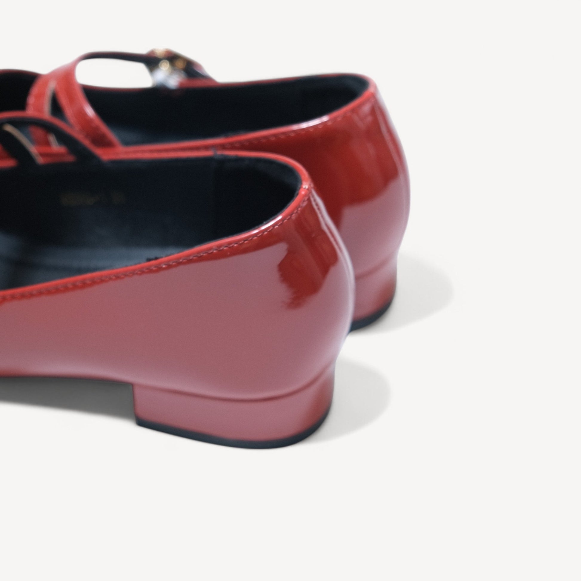 red patent mary jane buckle round toe flats heel detail  