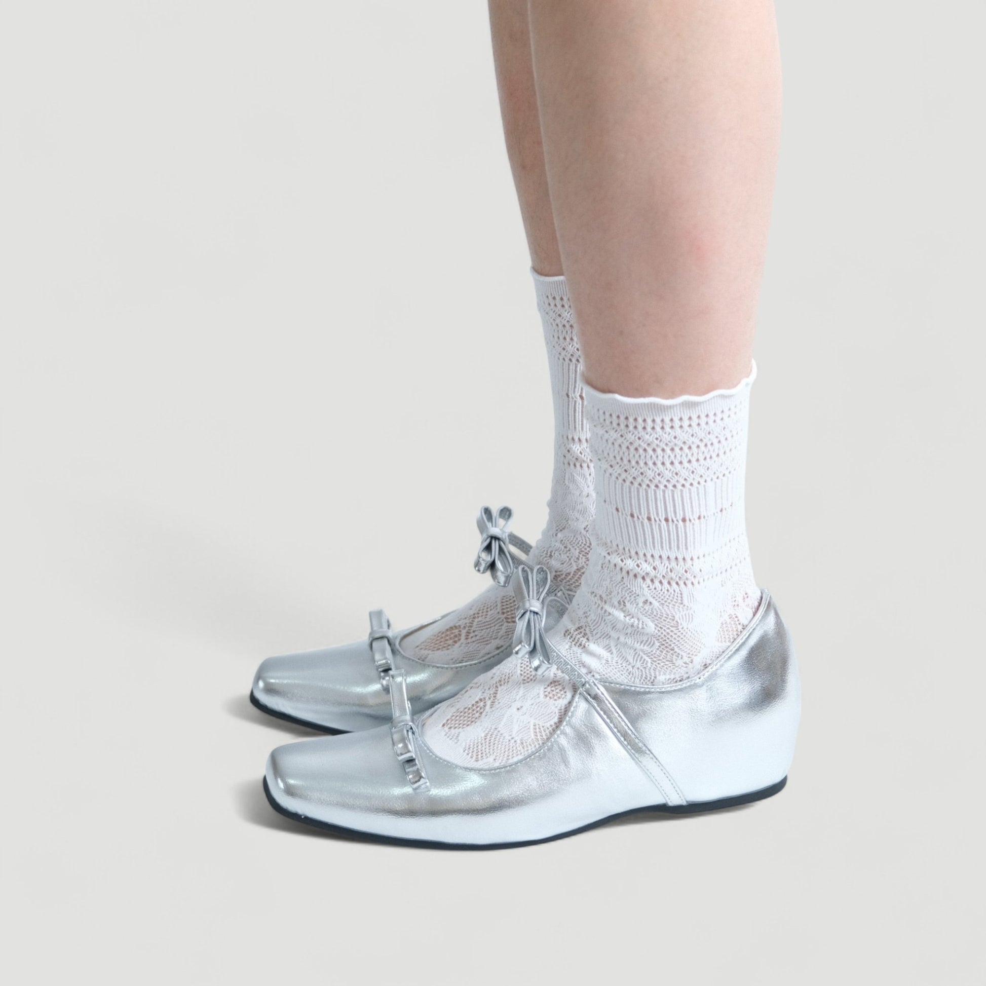 silver patent bow mary jane ballet flats model standing  