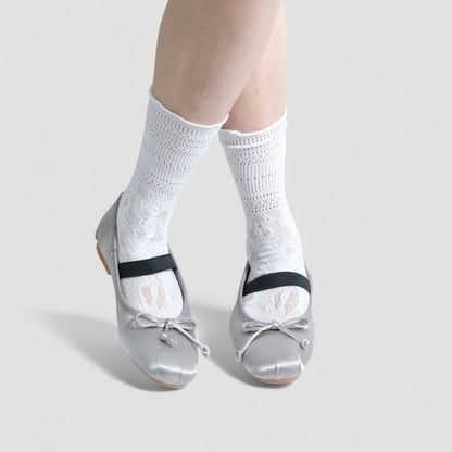 silver satin ballet flats model posing