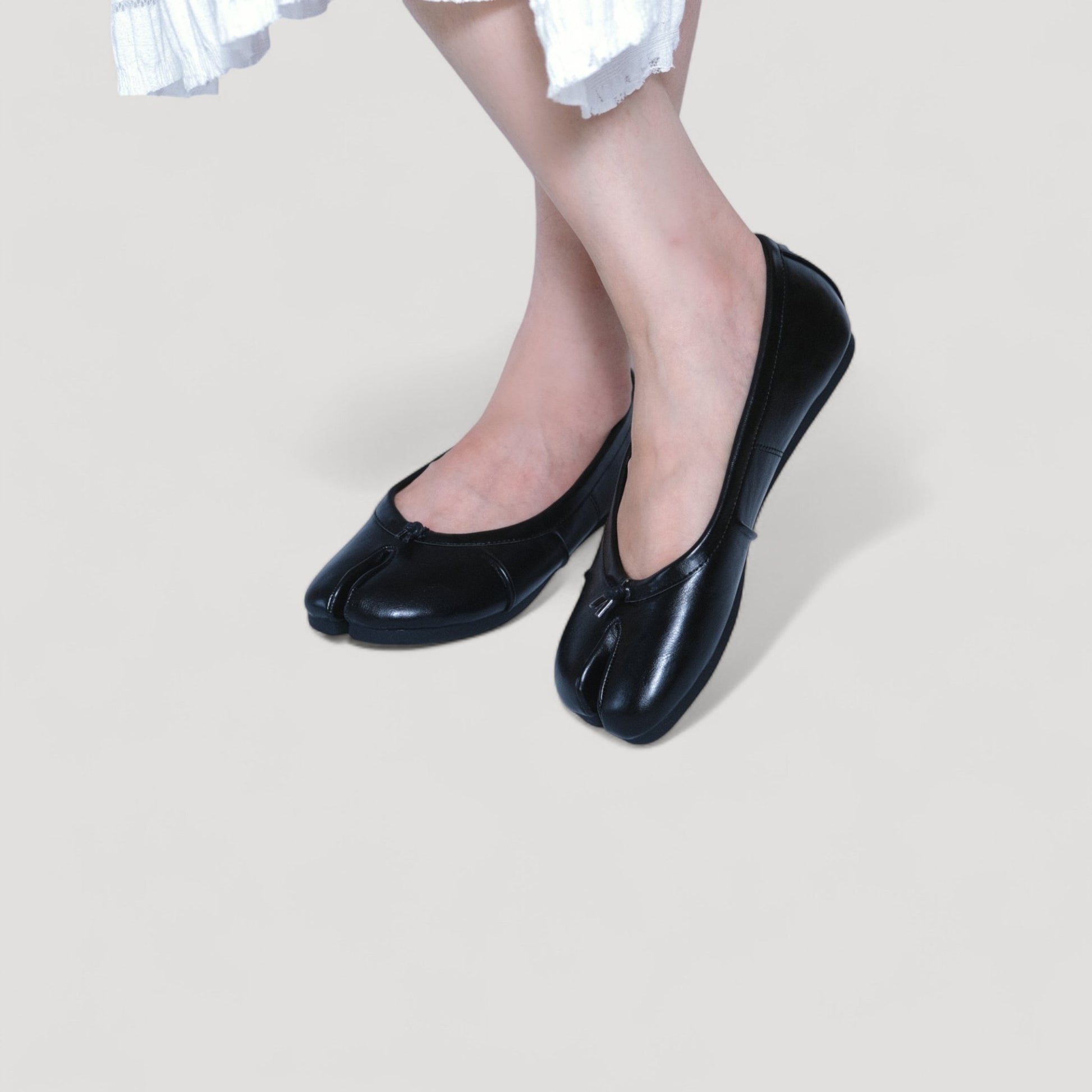 split toe leather flats tabis black model posing
