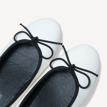 white almond toe bow ballet flats toe detail  
