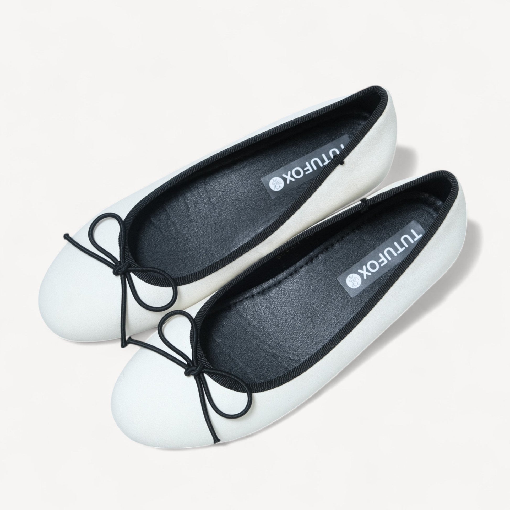 white almond toe bow ballet flats oblique view  